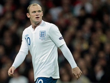 England's Wayne Rooney  reacts, during the Euro 2012 Group G qualifying soccer match between England and Montenegro at Wembley Stadium in London, Tuesday, Oct. 12, 2010. (AP Photo/Matt Dunham)