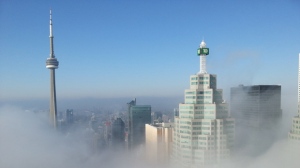 File photo of the Toronto skyline shrouded by fog.