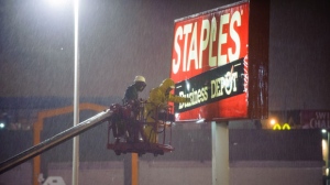 Sandy, storm damage, woman killed, Staples sign