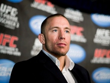 UFC welterweight champion Georges St-Pierre attends a news conference in Montreal, Tuesday, October 12, 2010, to promote his upcoming fight against Josh Koscheck which takes place in Montreal on December 11, 2010. (THE CANADIAN PRESS/Graham Hughes)