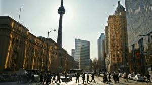 Commuters walk along Bay Street in downtown Toronto Tuesday March 12, 2002. (CP PHOTO/Kevin Frayer)