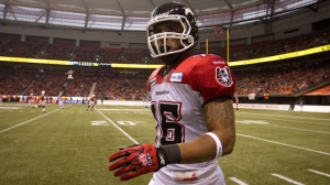 Calgary Stampeders' Marquay McDaniel walks to the bench after scoring a touchdown against the B.C. Lions during the first half of the CFL Western Final football game in Vancouver, B.C., on Sunday, Nov. 18, 2012. (The Canadian Press/Darryl Dyck)