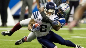 Montreal Alouettes defensive player Jerald Brown tackles Toronto Argonauts running back Chad Owens during second quarter Canadian Football League Eastern final action Sunday, Nov. 18, 2012, in Montreal. (The Canadian Press/Ryan Remiorz)