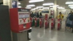 A machine that dispenses TTC tokens is pictured inside a subway station.