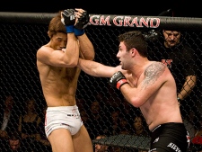 Welterweight Karo (The Heat) Parisyan (right) throws a punch at South Korean Dong Hyun Kim at UFC 94 on Jan. 31, 2008 in Las Vegas, Nev. (THE CANADIAN PRESS/HO, UFC - Josh Hedges)
