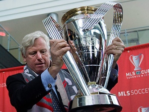 City of Toronto Mayor David Miller places the MLS Cup trophy on its stand to kick off MLS Cup 2010 festivities for Sunday's Major League Soccer championship game between FC Dallas and the Colorado Rapids in Toronto on Wednesday, November 17, 2010. (THE CANADIAN PRESS/Nathan Denette)