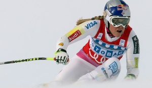 Lindsey Vonn, of the United States, speeds down the course on her way to win an alpine ski, women's World Cup super-G, in St. Moritz, Switzerland, Saturday, Dec .8, 2012. (AP Photo/Marco Trovati)