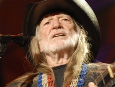 Willie Nelson performs during the Farm Aid Concert event Sunday, Oct. 4, 2009, in St. Louis. (AP / Kyle Ericson)