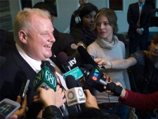 Rob Ford, left, talks with the media after speaking on air at Talk Radio AM 640 in Toronto on Oct. 27, 2010. (Nathan Denette / THE CANADIAN PRESS)