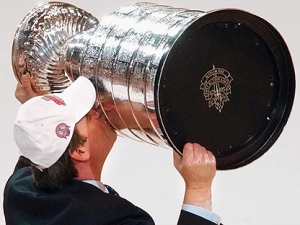 New Jersey Devils head coach Pat Burns kisses the Stanley Cup after the Devils defeated the Anaheim Mighty Ducks 3-0 in Game 7 of the Stanley Cup Finals in East Rutherford, N.J., Monday June 9, 2003. (AP Photo/Bill Kostroun)