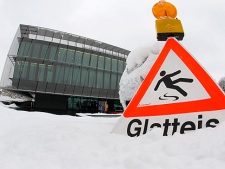 A sign warns of icy conditions in front of the FIFA headquarters in Zurich, Switzerland, Thursday, Dec.2, 2010. FIFA will announce the 2018 and 2022 Soccer World Cup hosts later the day. (AP Photo/Michael Probst)
