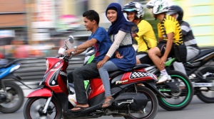 Aceh Indonesia law ban women straddling motorbikes