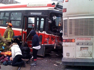 Emergency crews attend to victims after a TTC streetcar crashed with a Greyhound bus on Thursday Dec. 16, 2010. (CP24/MyBreakingNews)