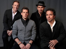 In this Oct. 8, 2010 photo, the Canadian Tenors, from left, Fraser Walters, Clifton Murray, Victor Micallef and Remigio Pereira pose for a photo in Los Angeles. (AP Photo/Damian Dovarganes)