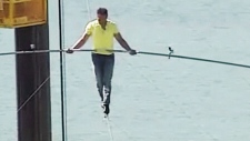 Nik Wallenda walks on a wire