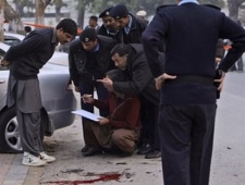 Pakistani police officers collect evidence at the scene where Punjab Gov. Salman Taseer was shot dead by one of his guards, in Islamabad, Pakistan, Tuesday, Jan. 4, 2011. The governor of Pakistan's powerful Punjab province was assassinated Tuesday by one of his guards.� Read less