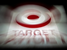 In this Nov. 16, 2010 photpo, a zoom lens creates an interesting effect on this photo of one of the signs on the Target store in Montgomery, Ala. Target is expanding North, agreeing Thursday, Jan. 13, 2011, to acquire most leases of Canadian mass-merchant chain Zellers and planning to open its first Canadian stores in 2013.(AP Photo/Dave Martin)