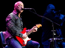 British musician Mark Knopfler , well known his time when he played with the band 'Dire Straits', performs on stage at the Festhalle in Frankfurt am Main, Germany, on Monday, June 7, 2010. (AP Photo/dapdMario Vedder)