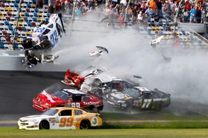 Kyle Larson (32) goes into the catch fence during a crash at the conclusion of the NASCAR Nationwide Series auto race Saturday, Feb. 23, 2013, at Daytona International Speedway in Daytona Beach, Fla.  (AP /Terry Renna) 