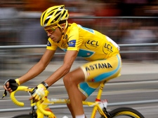 In this July 25, 2010, file photo, Alberto Contador of Spain speeds down the Champs Elysees during the 20th and last stage of the Tour de France cycling race in Paris, France. Spanish cycling officials have proposed a one-year ban for Alberto Contador for failing a Tour de France doping test, the Spanish cyclist confirmed on Wednesday, Jan. 26, 2011. (AP Photo/Laurent Rebours)