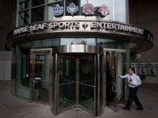 A man walks into Maple Leafs Sports and Entertainment's office at the Air Canada Centre in Toronto in this Wednesday, Dec. 1, 2010, file photo. MLSE is partnering with Live Nation to manage event sponsorships and ticket sales in Toronto. (THE CANADIAN PRESS/Darren Calabrese)