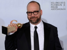 Paul Giamatti holds the award he won for Best Performance by an Actor in a Motion Picture - Comedy Or Musical for his role in "Barney's Version," at the Golden Globe Awards on Sunday, Jan. 16, 2011. Giamatti is nominated for a Genie Award for the same role. (AP/Matt J. Terrill)