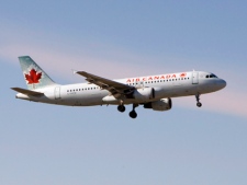 An Air Canada plane lands at Pearson Airport in Toronto on Friday Feb. 13, 2009. (THE CANADIAN PRESS/Frank Gunn)
