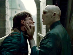 In this film publicity image released by Warner Bros. Pictures, Daniel Radcliffe, left, and Ralph Fiennes are shown in a scene from "Harry Potter and the Deathly Hallows: Part 2." (AP/Warner Bros. Pictures)