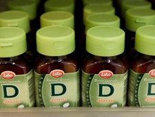 Bottles of Vitamin D supplements sit on a drug store shelf. (THE CANADIAN PRESS/Andrew Vaughan)