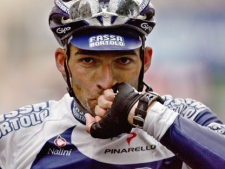 In this Thursday, July 7, 2005 file photo, Lorenzo Bernucci of Italy, of Team Fassa Bortolo, reacts as he crosses the finish line to win the sixth stage of the Tour de France cycling race between Troyes and Nancy, eastern France. (AP Photo/Christophe Ena, File)