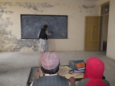 A boy writes on the blackboard at a school in the village of Khoshab in Kandahar's rural Daman district on Jan. 27, 2011. The school is one of 50 "signature" schools Canada is building, renovating and expanding in the province. (THE CANADIAN PRESS/A.R. Khan)