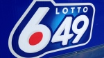 A sign outside a Toronto convenience store advertises a Lotto 6/49 draw. (Chris Kitching/CP24)