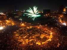 Egyptians set off fireworks as they celebrate after President Hosni Mubarak resigned and handed power to the military at Tahrir Square, in Cairo, Egypt, on Friday, Feb. 11, 2011. (AP Photo/Khalil Hamra)