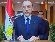 In this photo taken from Egyptian television, Egypt's vice president Omar Suleiman makes the announcement that Egyptian President Hosni Mubarak has stepped down from office, Friday, Feb. 11, 2011, in Cairo, Egypt. (AP Photo/Egypt TV)