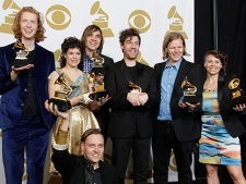 Arcade Fire pose backstage with the award for album of the year at the 53rd annual Grammy Awards on Sunday, Feb. 13, 2011, in Los Angeles. (AP Photo/Jae C. Hong)