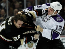 Anaheim Ducks left wing Aaron Voros, left, fights against Los Angeles Kings left wing Kyle Clifford (13) in the first period of an NHL hockey game in Anaheim, Calif., Monday, Nov. 29, 2010. (AP Photo/Alex Gallardo)