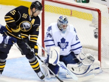 Toronto Maple Leafs goalie Jean-Sebastien Giguere makes a save on a redirected shot by Buffalo Sabres centre Jochen Hecht during an NHL game in Buffalo, N.Y., on Wednesday, Feb. 16, 2011. (AP Photo/ Don Heupel)