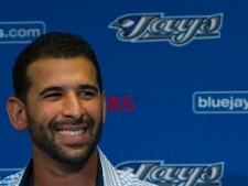 Toronto Blue Jays slugger Jose Bautista smiles during a press conference in Dunedin, Fla., Thursday, Feb. 17, 2011. The Blue Jays locked up Bautista with a US$64-million, five-year extension. (THE CANADIAN PRESS/Nathan Denette)