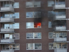 Firefighters battled a blaze inside an eighth-floor apartment suite at 91 Cosburn Ave. on Friday, Feb. 18, 2011. (Photo courtesy of Justin Cates)