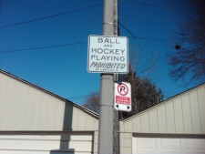 This street sign warns people on Melita Avenue that road hockey is not allowed. Two councillors want the city to relax its road hockey ban. (Photo courtesy of Ian McLellan)