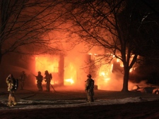 Firefighters battle a house fire on Colonsay Road in Markham on Tuesday, Feb. 22, 2011. (CP24/Tom Stefanac)