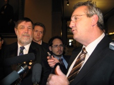Ontario Progressive Conservatives Randy Hillier, right, and Bill Murdoch speak to reporters Wedensday Dec. 2, 2009, outside the legislature in Toronto. (THE CANADIAN PRESS/ Maria Babbage)