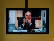 The Chairman of the CRTC, Konrad von Finckenstein, is seen on a TV screen during CRTC hearings in Gatineau, Que., on Thursday Nov. 12, 2009. (THE CANADIAN PRESS/Sean Kilpatrick)