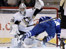 Toronto Maple Leafs centre Mikhail Grabovski tumbles after scoring his game winning goal on Pittsburgh Penguins goaltender Marc-Andre Fleury (left) in overtime NHL hockey action in Toronto on Wednesday March 2, 2011. (THE CANADIAN PRESS/Frank Gunn)