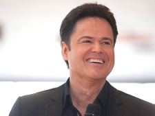 Donny Osmond smiles at a press conference in Toronto on Monday March 7, 2011. Donny and Marie Osmond are bringing their popular stage show to Toronto's Four Seasons Centre for the Performing Arts from July 5 to 17, which will mark their debut in the city. (THE CANADIAN PRESS/Chris Young)