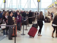 Crowds gather at Pearson International Airport for March Break flights Thursday, March 10, 2011.
