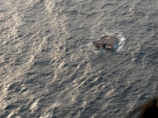 This photo provided by the U.S. Navy shows a Japanese home adrift in the Pacific Ocean on Sunday, March 13, 2011, days after a massive earthquake and the ensuing tsunami hit Japan's east coast. Ships and aircraft from the Ronald Reagan Carrier Strike Group are searching for survivors in the coastal waters near Sendai, Japan. (AP Photo/U.S. Navy, Dylan McCord)