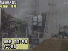 In this image made from Japan's NHK television, the No. 4 unit of the Fukushima Dai-ichi nuclear complex is seen damaged in Okumamachi, Japan, on Tuesday March 15, 2011. (AP Photo/NHK TV) 