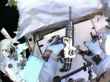 Astronauts spacewalk install new pump to fix leak