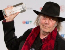 Neil Young poses with his Juno award for Adult Alternative Album of the Year at the 2011 Juno gala dinner and awards show in Toronto Saturday, March 26, 2011. (THE CANADIAN PRESS/Darren Calabrese)
